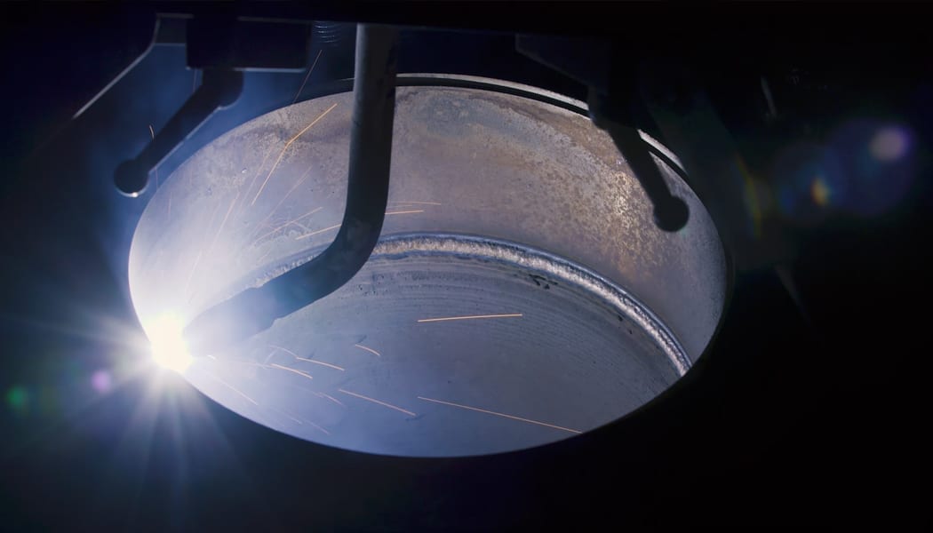 a close up shot of a hydraulic cylinder being welded internally