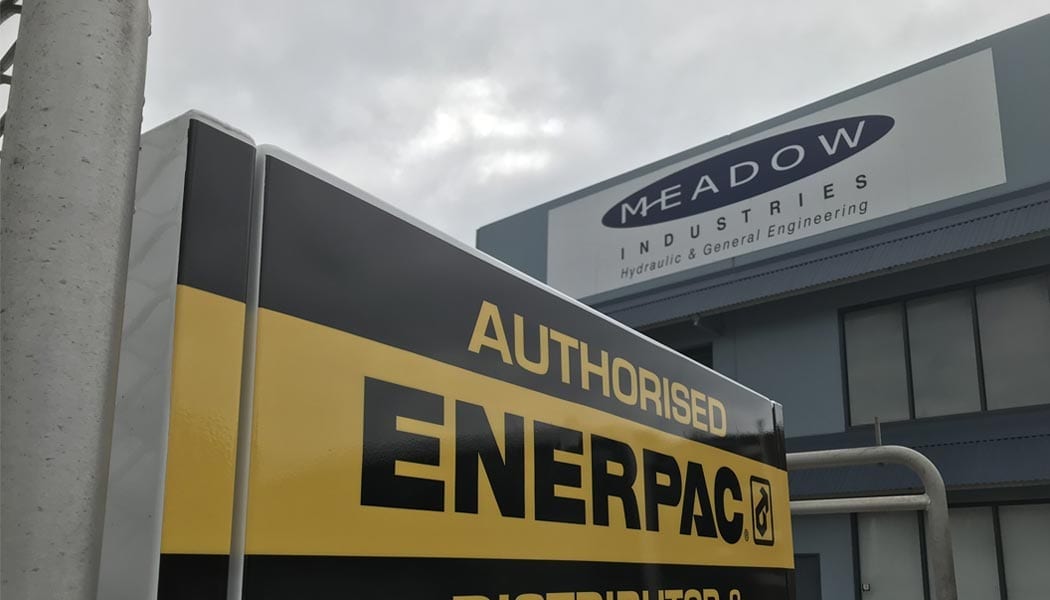 Front of Meadow industries building with a signage of Authorised Enerpac in the foreground
