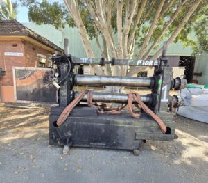 an old and worn out arbor slitter unit